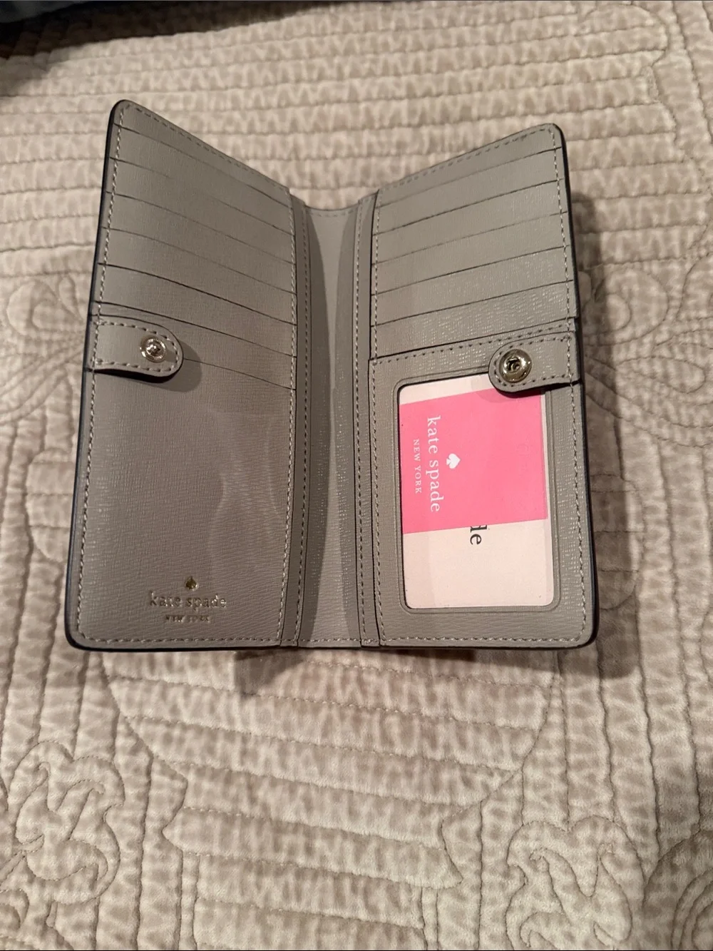 kate spade Pebbled Leather Long Wallet in Light Gray with Gold Logo